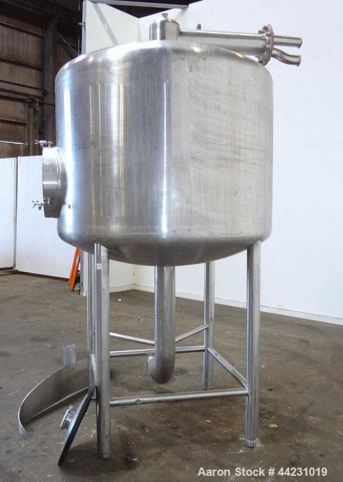 Used Tank, 450 Gallon, 304 Stainless Steel, Vertical. Approximate 60” diameter x 36” straight side, dished top and bottom. Top tangential inlet, top entering spray ball. Side 19” dameter man way with...