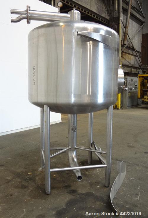 Used Tank, 450 Gallon, 304 Stainless Steel, Vertical. Approximate 60” diameter x 36” straight side, dished top and bottom. Top tangential inlet, top entering spray ball. Side 19” dameter man way with...