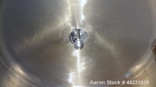 Used Tank, 450 Gallon, 304 Stainless Steel, Vertical. Approximate 60” diameter x 36” straight side, dished top and bottom. Top tangential inlet, top entering spray ball. Side 19” dameter man way with...