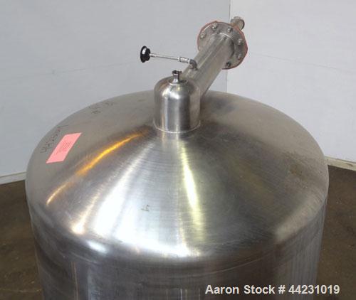 Used Tank, 450 Gallon, 304 Stainless Steel, Vertical. Approximate 60” diameter x 36” straight side, dished top and bottom. Top tangential inlet, top entering spray ball. Side 19” dameter man way with...