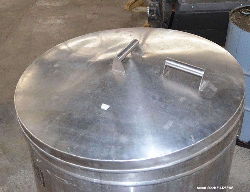 Used Tank, 100 Gallon, 304 Stainless Steel, Vertical. Approximate 31" diameter x 38" straight side. Open top with a 1 piece cover, 1" sloped bottom. 2-1/4" Side bottom outlet. Skirt mounted with cast...