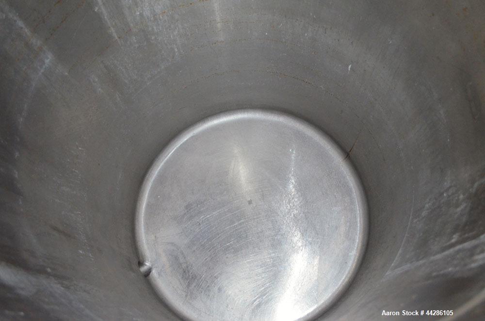 Used Tank, 100 Gallon, 304 Stainless Steel, Vertical. Approximate 31" diameter x 38" straight side. Open top with a 1 piece cover, 1" sloped bottom. 2-1/4" Side bottom outlet. Skirt mounted with cast...