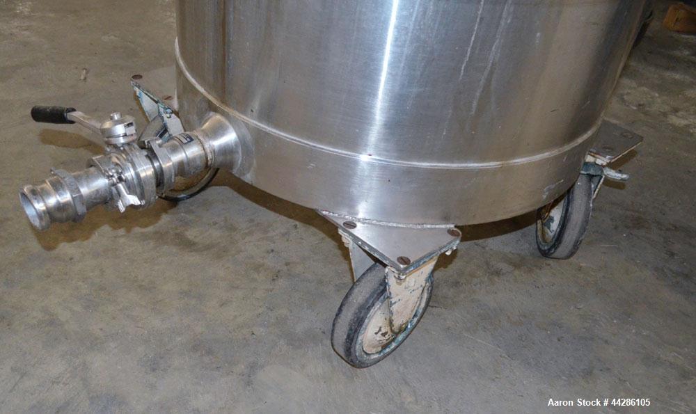 Used Tank, 100 Gallon, 304 Stainless Steel, Vertical. Approximate 31" diameter x 38" straight side. Open top with a 1 piece cover, 1" sloped bottom. 2-1/4" Side bottom outlet. Skirt mounted with cast...