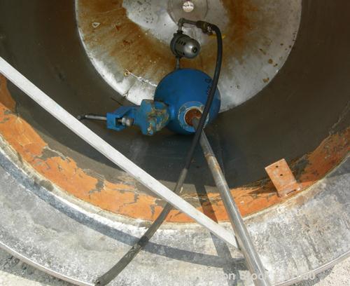 Used Tank, 225 gallon, 321 stainless steel, vertical. Approximate 36" diameter x 46" straight side. Flat top with a 1/2 hinged cover, coned bottom. Includes a JWI air operated clamp-on agitator, mode...
