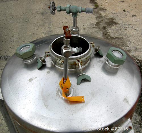 Used Tank, 55 Gallon, 321 Stainless Steel, Vertical. 24" Diameter X 28" straight side, dish top and bottom. Openings:  top (2) 1-1/2", (2) 2", 5-3/4"; 1-1/2" center bottom outlet. Mounted on 3 carbon...