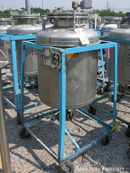 Used Norwalk Pressure Tank, 50 Gallon, Stainless Steel, Vertical. Approximately 24'' diameter x 24'' straight side, dished top and bottom. Internal rated 50 psi at 300 deg F. Top manway, center botto...