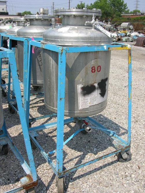 Used Norwalk Pressure Tank, 50 Gallon, Stainless Steel, Vertical. Approximately 24" diameter x 24" straight side, dished top and bottom. Internal rated 50 psi at 300 deg F. Top manway, center bottom ...