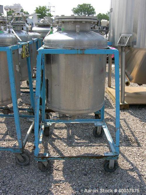 Used Norwalk Pressure Tank, 50 Gallon, Stainless Steel, Vertical. Approximately 24'' diameter x 24'' straight side, dished top and bottom. Internal rated 50 psi at 300 deg F. Top manway, center botto...