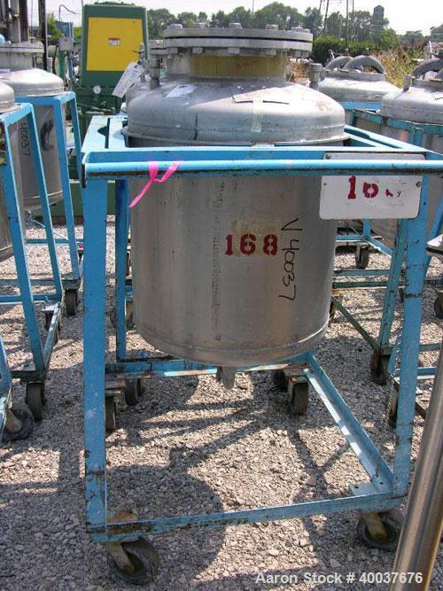 Used Norwalk Pressure Tank, 50 Gallon, Stainless Steel, Vertical. Approximately 24'' diameter x 24'' straight side, dished top and bottom. Internal rated 50 psi at 300 deg F. Top manway, center botto...