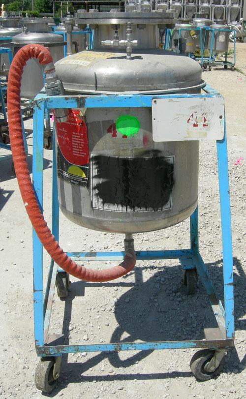 Used O.G. Kelley Co. Pressure Tank, 55 gallon, 304 stainless steel, vertical. 24'' diameter x 27'' straight side, dished top and bottom. Internal rated 50 psi at 300 deg F. Openings: top 10'' with co...