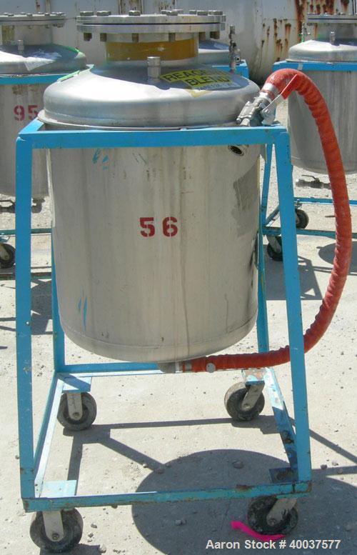 Used O.G. Kelley Co. Pressure Tank, 55 gallon, 304 stainless steel, vertical. 24'' diameter x 27'' straight side, dished top and bottom. Internal rated 50 psi at 300 deg F. Openings: top 10'' with co...