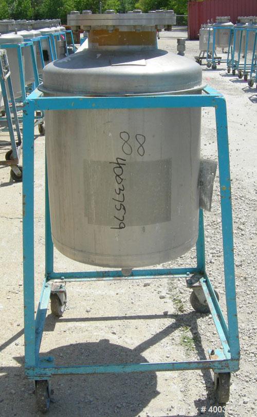 Used O.G. Kelley Co. Pressure Tank, 55 gallon, 304 stainless steel, vertical. 24'' diameter x 27'' straight side, dished top and bottom. Internal rated 50 psi at 300 deg F. Openings: top 10'' with co...