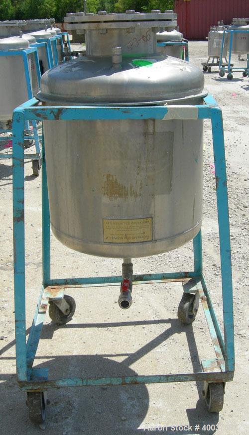 Used O.G. Kelley Co. Pressure Tank, 55 gallon, 304 stainless steel, vertical. 24'' diameter x 27'' straight side, dished top and bottom. Internal rated 50 psi at 300 deg F. Openings: top 10'' with co...