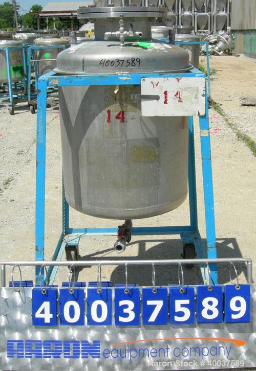 Used O.G. Kelley Co. Pressure Tank, 55 gallon, 304 stainless steel, vertical. 24'' diameter x 27'' straight side, dished top and bottom. Internal rated 50 psi at 300 deg F. Openings: top 10'' with co...