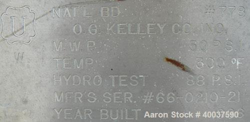 Used O.G. Kelley Co. Pressure Tank, 55 gallon, 304 stainless steel, vertical. 24'' diameter x 27'' straight side, dished top and bottom. Internal rated 50 psi at 300 deg F. Openings: top 10'' with co...