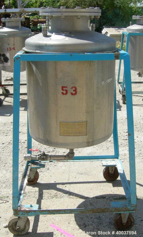 Used O.G. Kelley Co. Pressure Tank, 55 gallon, 304 stainless steel, vertical. 24'' diameter x 27'' straight side, dished top and bottom. Internal rated 50 psi at 300 deg F. Openings: top 10'' with co...