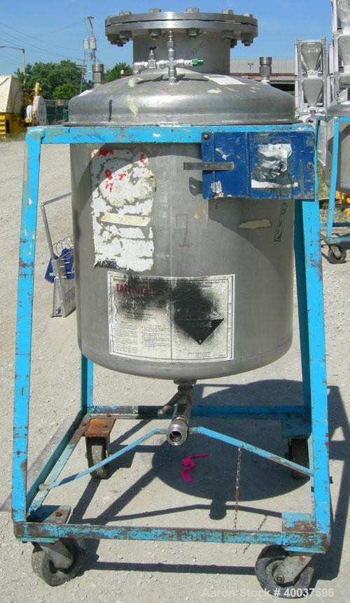 Used O.G. Kelley Co. Pressure Tank, 55 gallon, 304 stainless steel, vertical. 24'' diameter x 27'' straight side, dished top and bottom. Internal rated 50 psi at 300 deg F. Openings: top 10'' with co...