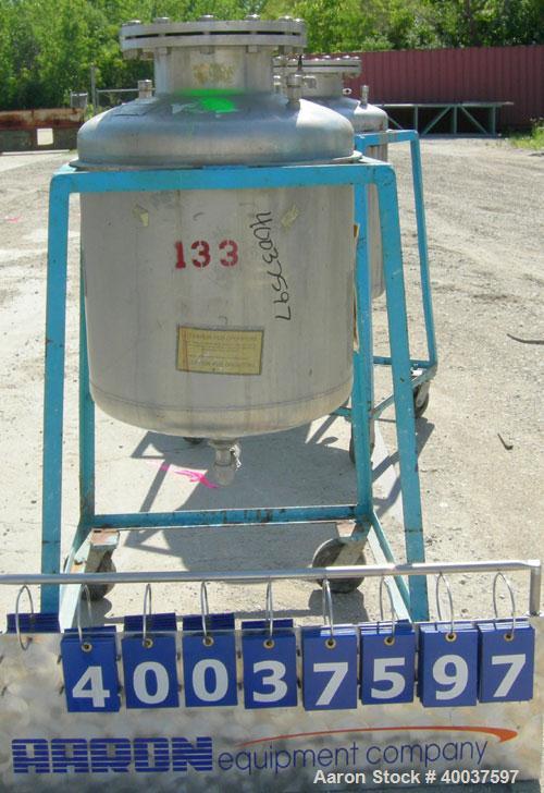 Used O.G. Kelley Co. Pressure Tank, 55 gallon, 304 stainless steel, vertical. 24'' diameter x 27'' straight side, dished top and bottom. Internal rated 50 psi at 300 deg F. Openings: top 10'' with co...
