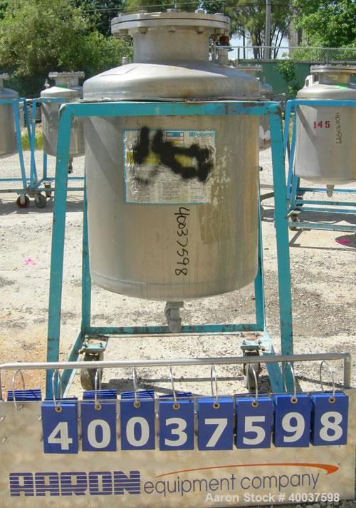 Used O.G. Kelley Co. Pressure Tank, 55 gallon, 304 stainless steel, vertical. 24'' diameter x 27'' straight side, dished top and bottom. Internal rated 50 psi at 300 deg F. Openings: top 10'' with co...