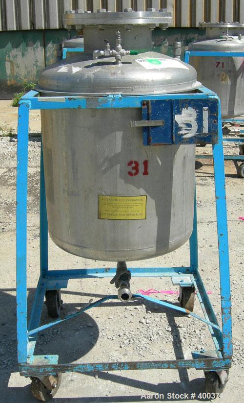 Used O.G. Kelley Co. Pressure Tank, 55 gallon, 304 stainless steel, vertical. 24'' diameter x 27'' straight side, dished top and bottom. Internal rated 50 psi at 300 deg F. Openings: top 10'' with co...