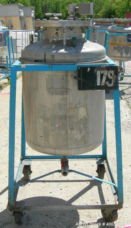 Used O.G. Kelley Co. Pressure Tank, 55 gallon, 304 stainless steel, vertical. 24'' diameter x 27'' straight side, dished top and bottom. Internal rated 50 psi at 300 deg F. Openings: top 10'' with co...