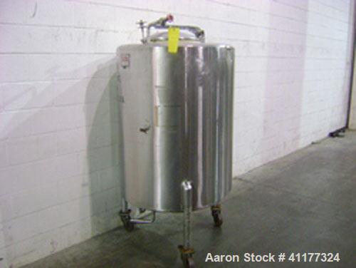 Used Perma-San Tank, 150 gallon, stainless steel, vertical. Closed top with manway, sloped bottom. Mounted on 3 legs with casters.