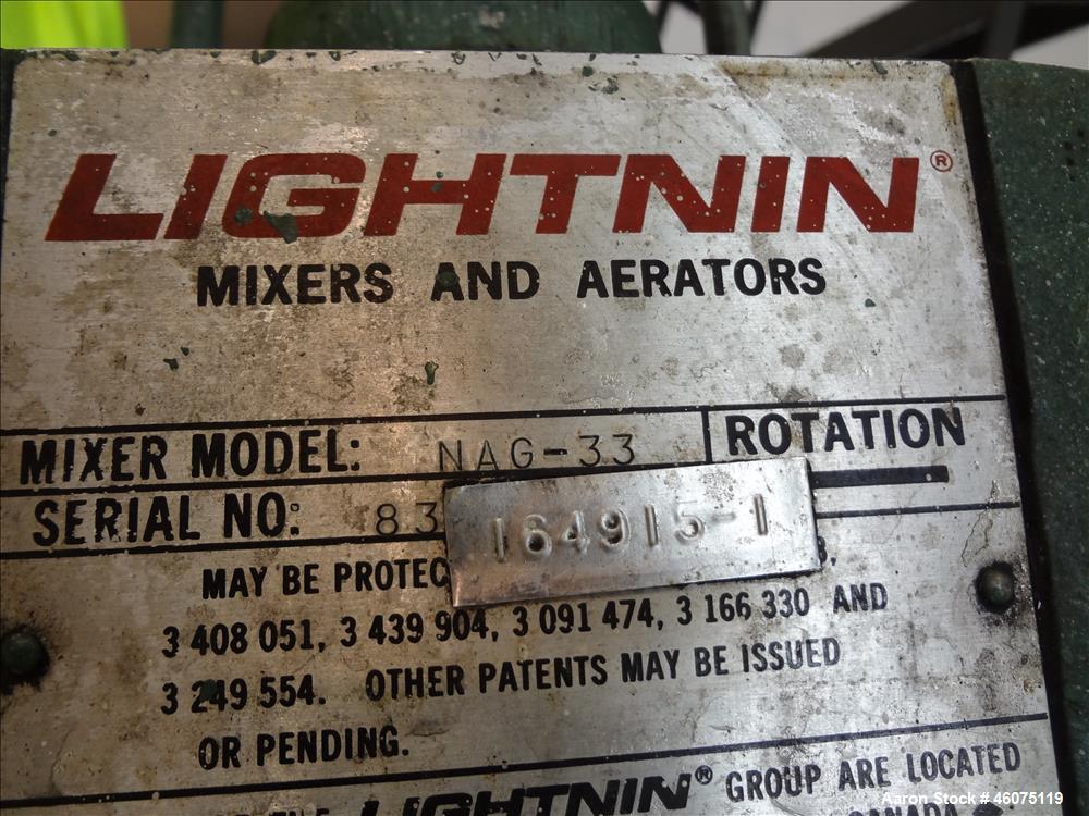Used Perry Products Tank, Approximate 300 Gallon, 304 Stainless Steel, Vertical. Approximate 44" diameter x 50" straight side, flat top, coned bottom. Off center top entering air operated Lightnin ag...