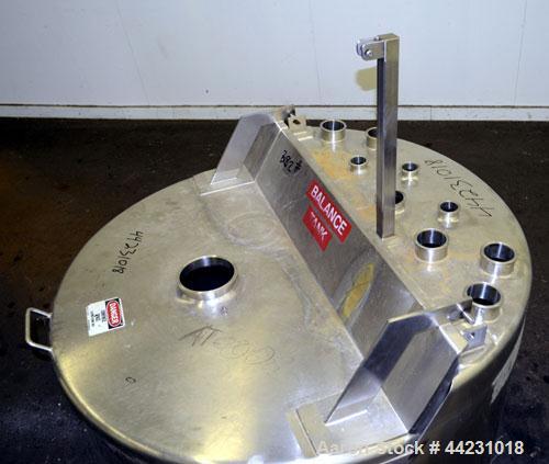 Used Stainless Concepts Balance Tank, 200 Gallon, 316 Stainless Steel, Vertical. Approximate 50" diameter x 23" straight side. 2/3 Hinged top cover, sloped bottom. Openings top (3) 2", (6) 3", 6". Si...