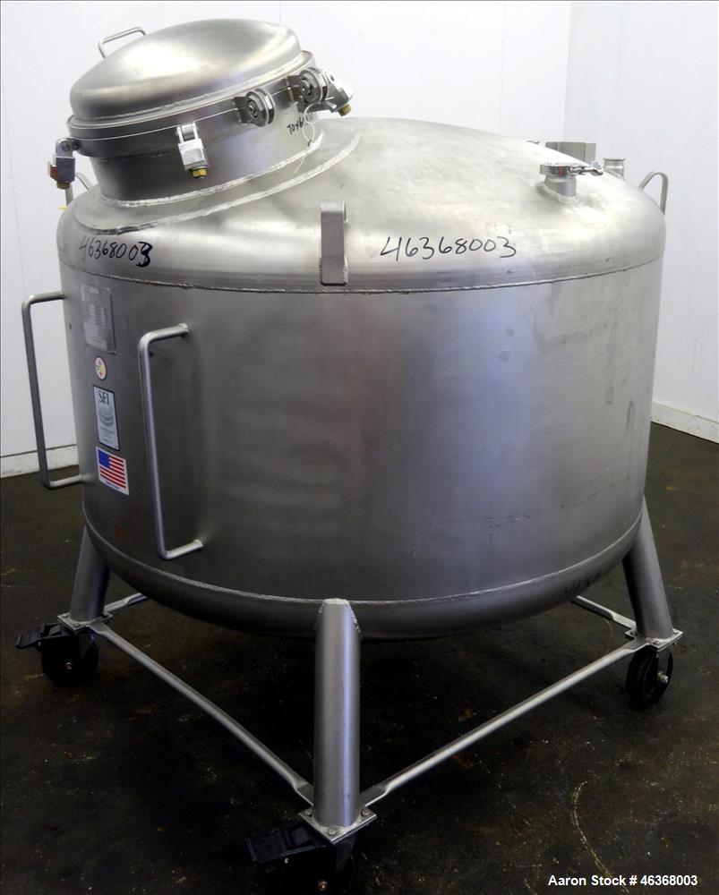 Used Stainless Fabrication Pressure Tank, 275 Gallon, 316L Stainless Steel, Vertical. 54" Diameter x 23-1/2" straight side, dished top and bottom. Internal rated 50 psi at -20 to 350 degrees F. Openi...