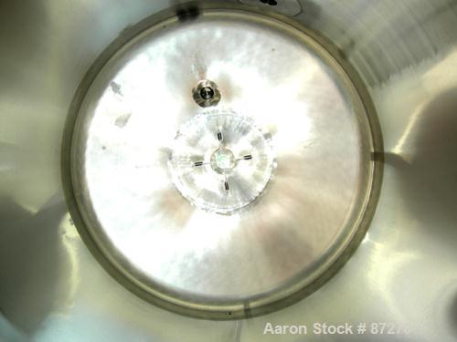 USED: T&C stainless pressure tank, 1000 liter (264 gallon), 316L stainless steel, vertical. 40" diameter x 48" straight side. Dished top and bottom. Internal rated 50 psi/FV at 301 deg F. 304 stainle...