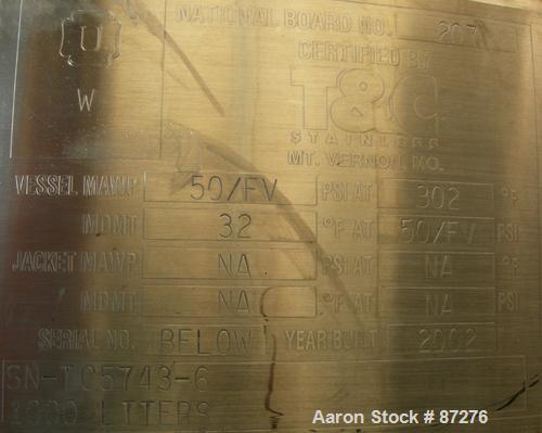 USED: T&C stainless pressure tank, 1000 liter (264 gallon), 316L stainless steel, vertical. 40" diameter x 48" straight side. Dished top and bottom. Internal rated 50 psi/FV at 301 deg F. 304 stainle...