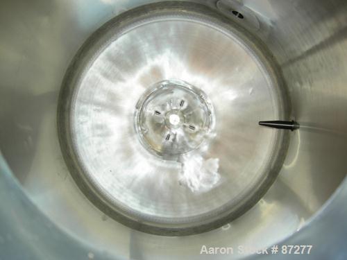 USED: T&C stainless pressure tank, 1000 liter (264 gallon), 316L stainless steel, vertical. 40" diameter x 48" straight side. Dished top and bottom. Internal rated 50 psi/FV at 301 deg F. 304 stainle...
