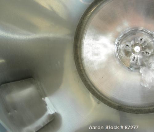 USED: T&C stainless pressure tank, 1000 liter (264 gallon), 316L stainless steel, vertical. 40" diameter x 48" straight side. Dished top and bottom. Internal rated 50 psi/FV at 301 deg F. 304 stainle...