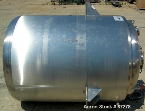USED: T&C stainless pressure tank, 1000 liter (264 gallon), 316L stainless steel, vertical. 40" diameter x 48" straight side. Dished top and bottom. Internal rated 50 psi/FV at 301 deg F. 304 stainle...