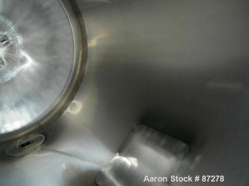 USED: T&C stainless pressure tank, 1000 liter (264 gallon), 316L stainless steel, vertical. 40" diameter x 48" straight side. Dished top and bottom. Internal rated 50 psi/FV at 301 deg F. 304 stainle...