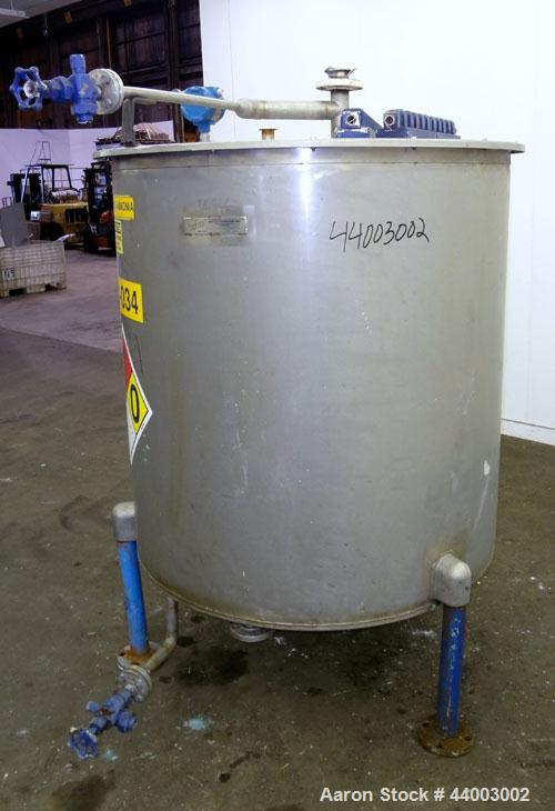 Used United Utensils Tank, 300 Gallon, Model VT-300, 304 Stainless Steel, Vertical. Approximate 45" diameter x 47" straight side. Flat top with a bolt on 1 piece cover, flat bottom. 2" Off center bot...