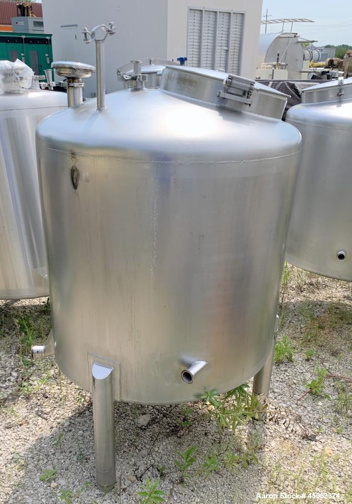 Used Walker 135 Gallon Stainless Steel Tank, Model SB-V-52, 304 Stainless Steel, Vertical. Approximate 36" diameter x 30" straight side. Dished top, sloped bottom. Openings: 16" manway with cover, 4"...