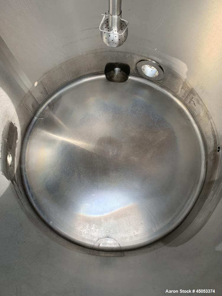 Used Walker 135 Gallon Stainless Steel Tank, Model SB-V-52, 304 Stainless Steel, Vertical. Approximate 36" diameter x 30" straight side. Dished top, sloped bottom. Openings: 16" manway with cover, 4"...