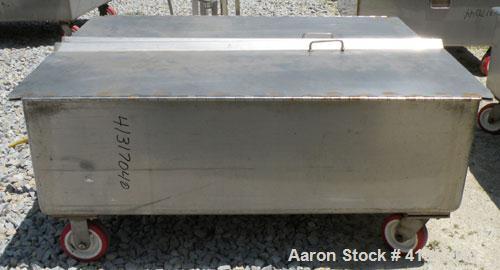 Used Walker Stainless Tank, 120 Gallon, Model SP-7144, 316L Stainless Steel. 50" long x 40" wide x 15" deep. 2 piece hinged top cover. 2" NPT end bottom outlet. Mounted on casters.