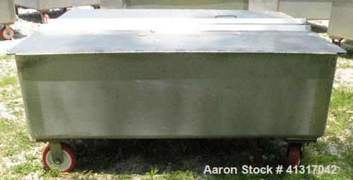 Used Walker Stainless Tank, 120 Gallon, Model SP-7144, 316L Stainless Steel. 50" long x 40" wide x 15" deep. 2 piece hinged top cover. 2" NPT end bottom outlet. Mounted on casters.