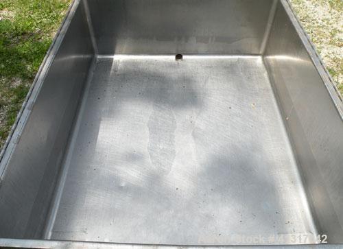 Used Walker Stainless Tank, 120 Gallon, Model SP-7144, 316L Stainless Steel. 50" long x 40" wide x 15" deep. 2 piece hinged top cover. 2" NPT end bottom outlet. Mounted on casters.