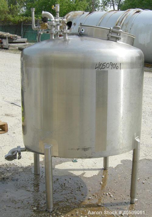 Used Walker Tank, 100 Gallon, 316L Stainless Steel, Vertical. 36" diameter x 27" straight side, dished top, sloped bottom. Internal rated to 250 deg F. Openings: top (3) 1" tri-clamp, 2" tri-clamp, 1...