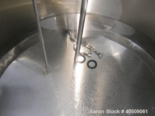 Used Walker Tank, 100 Gallon, 316L Stainless Steel, Vertical. 36" diameter x 27" straight side, dished top, sloped bottom. Internal rated to 250 deg F. Openings: top (3) 1" tri-clamp, 2" tri-clamp, 1...