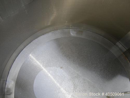 Used Walker Tank, 100 Gallon, 316L Stainless Steel, Vertical. 36" diameter x 27" straight side, dished top, sloped bottom. Internal rated to 250 deg F. Openings: top (3) 1" tri-clamp, 2" tri-clamp, 1...