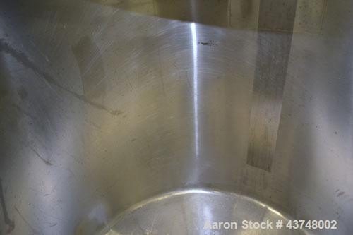 Used Walker Stainless Tank, 80 Gallon, 316 Stainless Steel, Vertical. 30” Diameter x 29” straight side. Open top with a 2 piece cover, coned bottom. Provision for a clamp-on agitator. 1-1/2” Tri-clam...