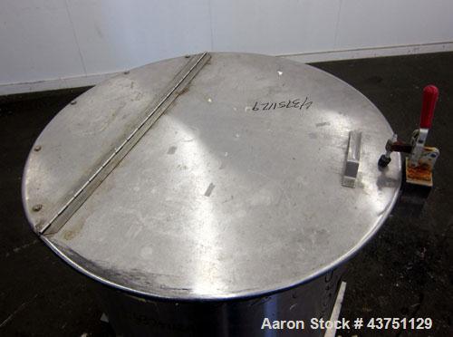 Used Water Cooling Corporation Tank, 100 Gallons, 304 Stainless Steel, Vertical. Approximately 31" diameter x 34" straight side.  Flat top with a bolt-on hinged cover, 6" sloped bottom.  2" Tri-clamp...