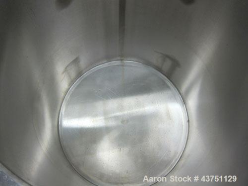 Used Water Cooling Corporation Tank, 100 Gallons, 304 Stainless Steel, Vertical. Approximately 31" diameter x 34" straight side.  Flat top with a bolt-on hinged cover, 6" sloped bottom.  2" Tri-clamp...