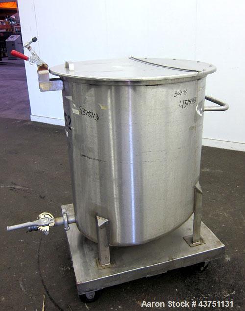 Used Water Cooling Corporation Tank, 100 Gallons, 304 Stainless Steel, Vertical. Approximately 31" diameter x 34" straight side.  Flat top with a bolt-on hinged cover, 6" sloped bottom.  2" Tri-clamp...
