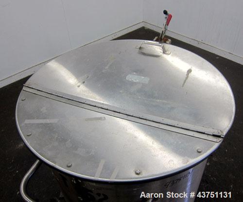 Used Water Cooling Corporation Tank, 100 Gallons, 304 Stainless Steel, Vertical. Approximately 31" diameter x 34" straight side.  Flat top with a bolt-on hinged cover, 6" sloped bottom.  2" Tri-clamp...