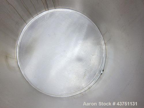 Used Water Cooling Corporation Tank, 100 Gallons, 304 Stainless Steel, Vertical. Approximately 31" diameter x 34" straight side.  Flat top with a bolt-on hinged cover, 6" sloped bottom.  2" Tri-clamp...